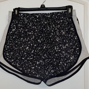 Black and white speckled Nike Dri-Fit shorts; Gently used.